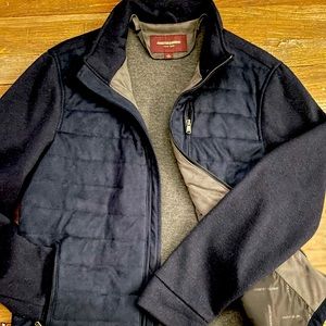 Polyester fleece jacket, quilted torso & knit sleeves. Size large in navy blue